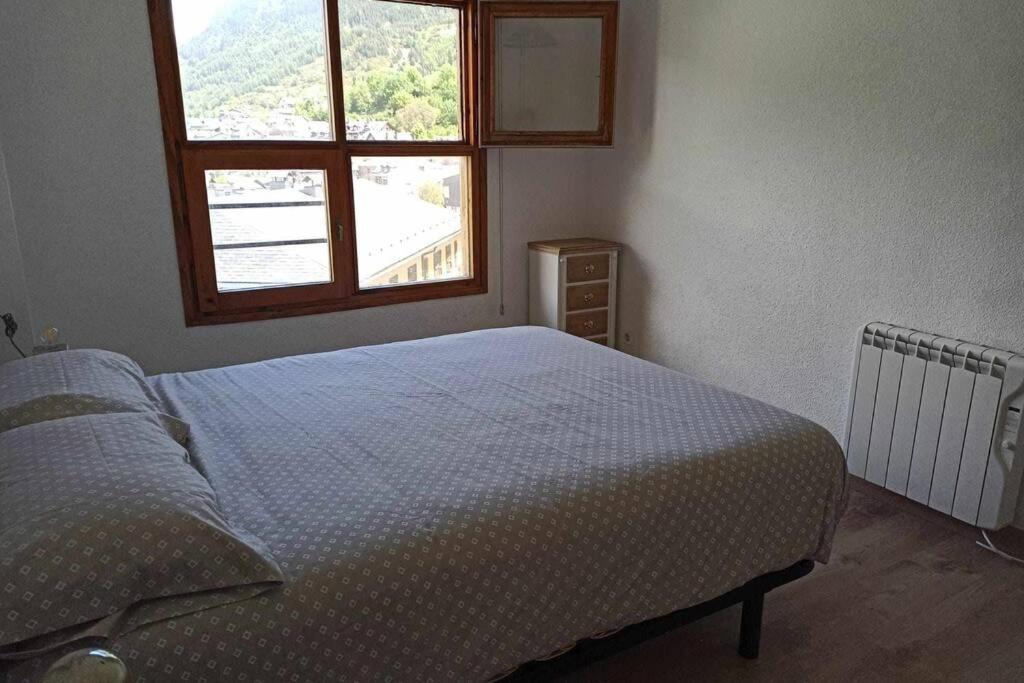 Postel nebo postele na pokoji v ubytování Inmocyma Ibonet-Cerler