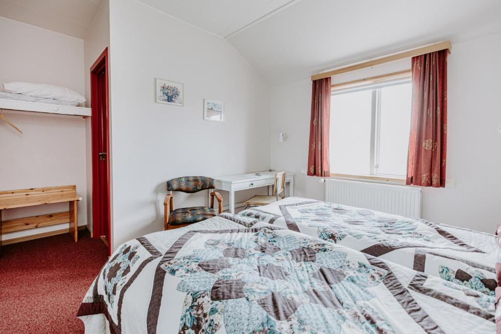 Postel nebo postele na pokoji v ubytování Narfastadir Guesthouse
