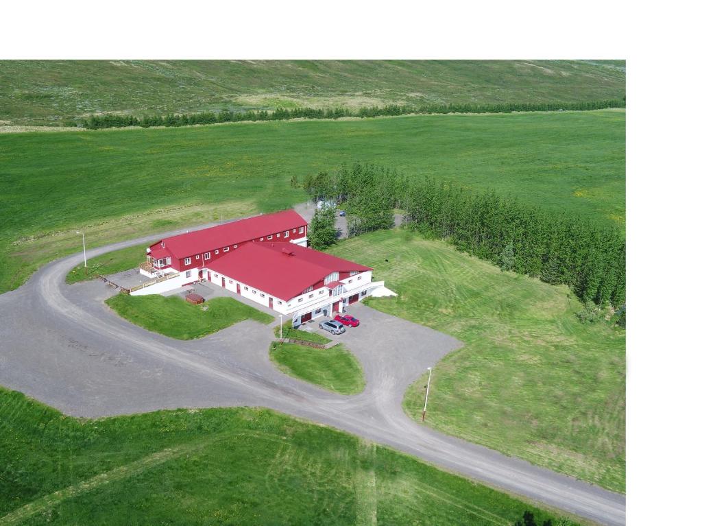 an overhead view of a barn with a red roof at Narfastadir Guesthouse in Laugar