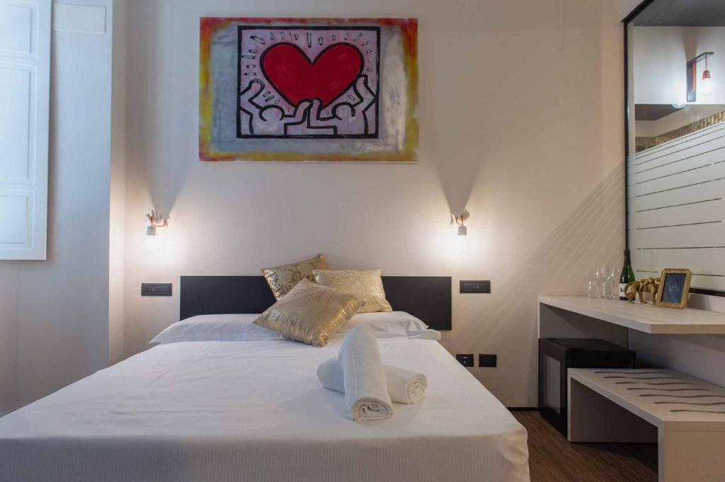 Postel nebo postele na pokoji v ubytování PALAZZO CIOTTI