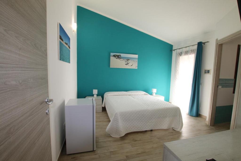 Postel nebo postele na pokoji v ubytování B&b Ajo' a mulinu Teulada