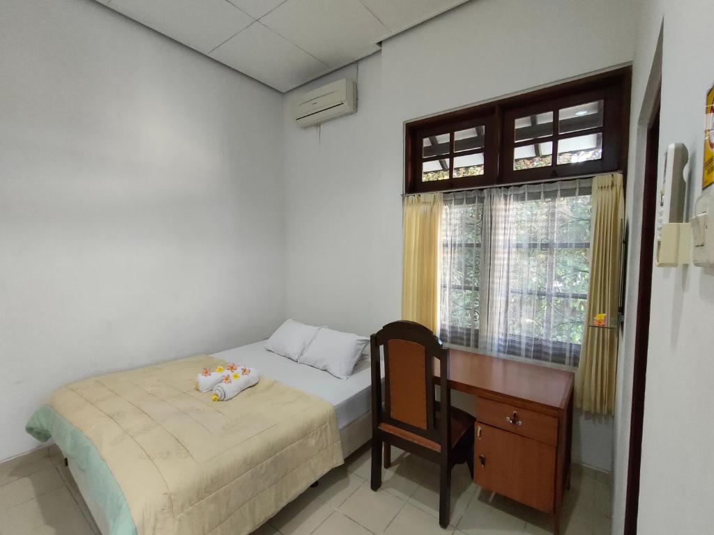Postel nebo postele na pokoji v ubytování Ayodya Inn , Yogyakarta Lodging , Digital Nomads , Entrepreneurs Centre , CoWorking Space , CoLiving , Kost Lengkap , Exclusive Boarding House and Student Accommodation in Jogjakarta City Center !