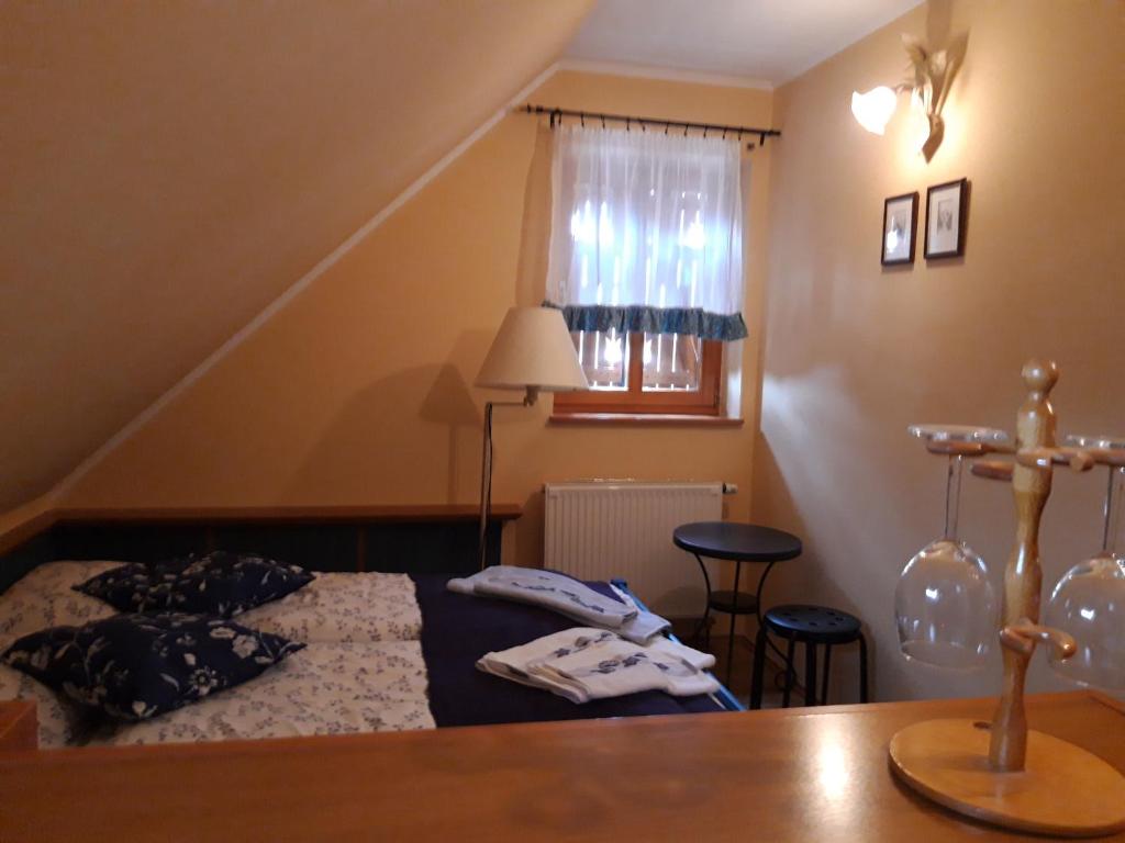Postel nebo postele na pokoji v ubytování Rudolf's Fogadó