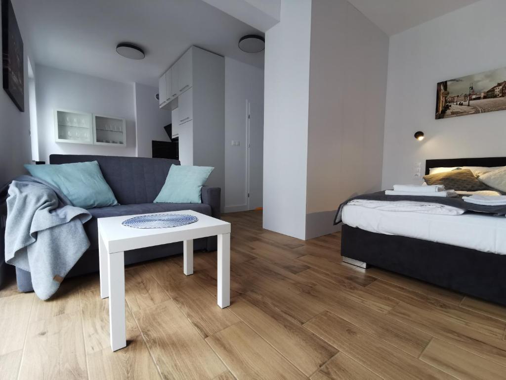 Posteľ alebo postele v izbe v ubytovaní Apartamenty Garbary 32 z klimatyzacja - air-conditioning