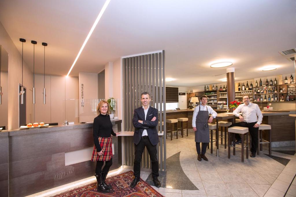 a group of people standing in a kitchen at Sporthotel Kapfenberg in Kapfenberg