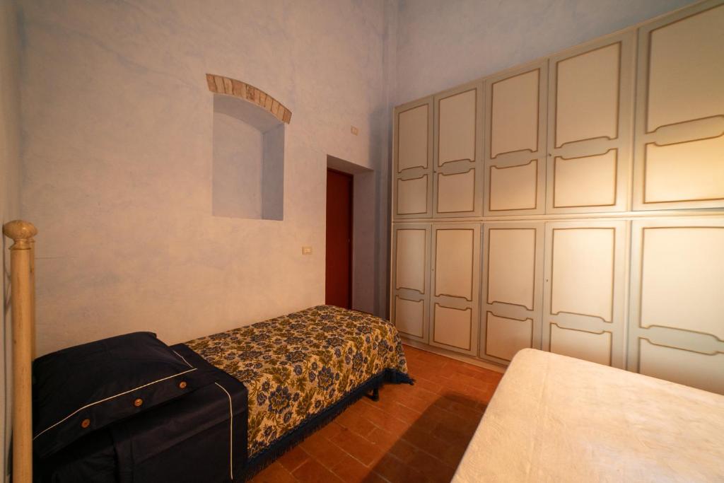 Postel nebo postele na pokoji v ubytování Dimora Terrazza sui Calanchi
