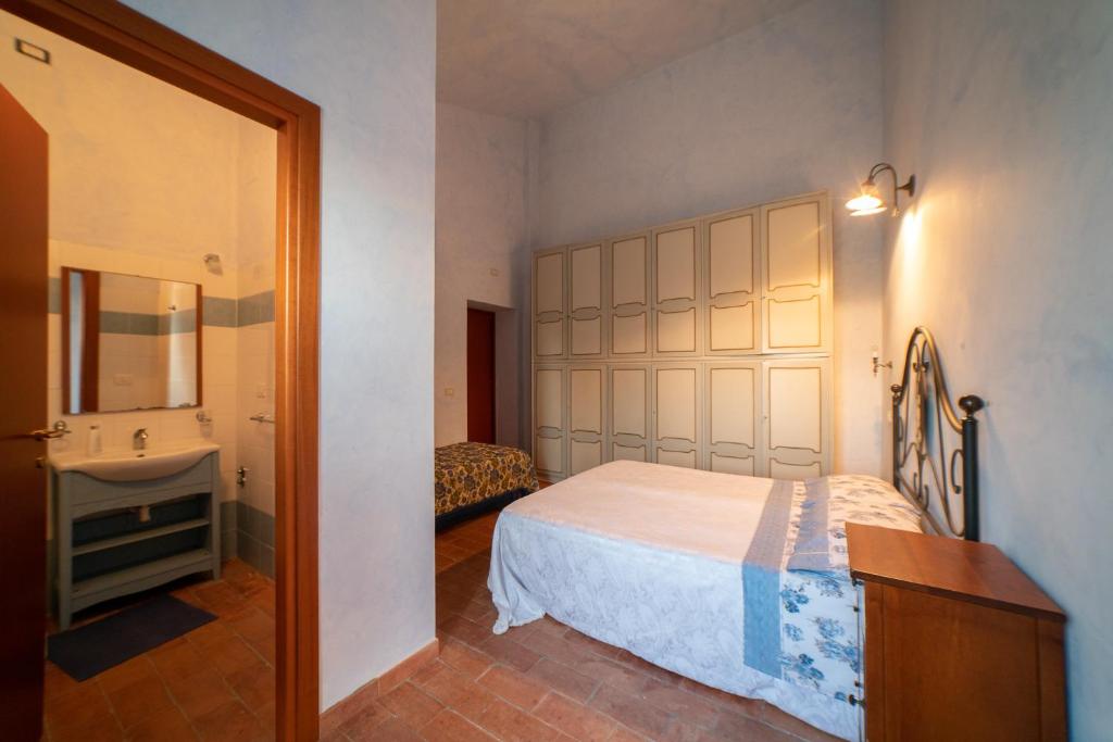 Postel nebo postele na pokoji v ubytování Dimora Terrazza sui Calanchi
