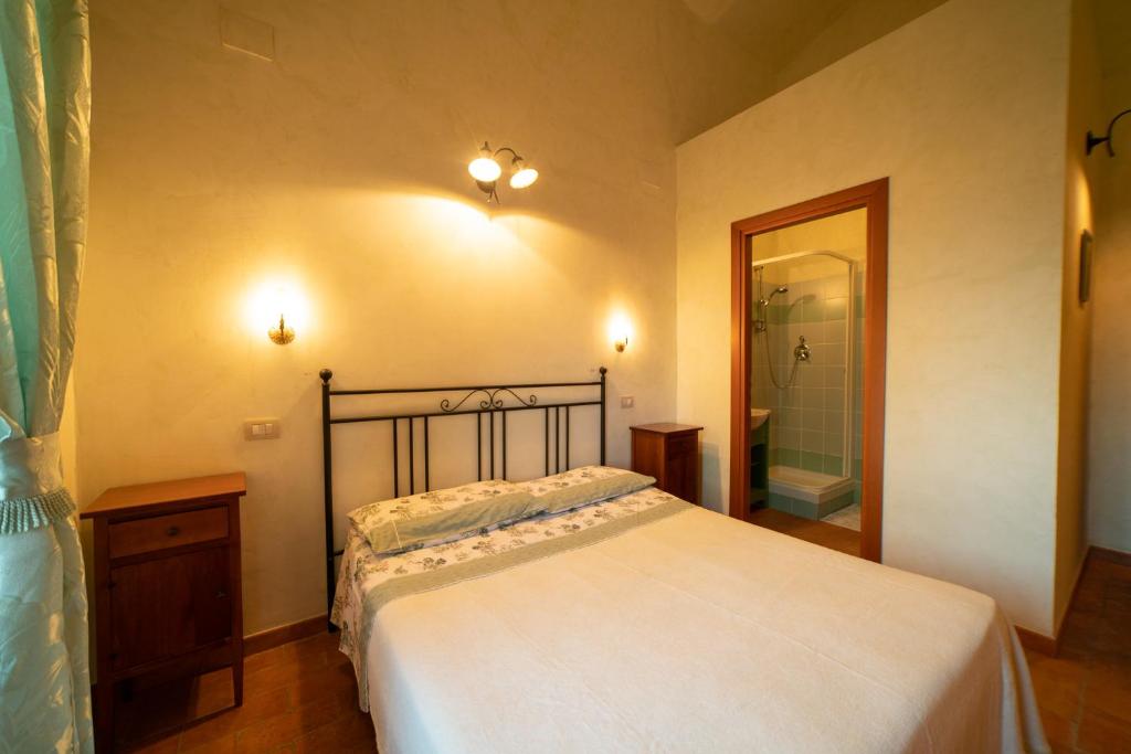 Postel nebo postele na pokoji v ubytování Dimora Terrazza sui Calanchi