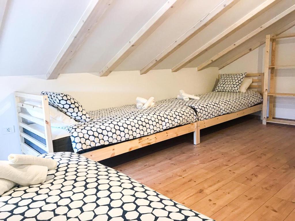 Postel nebo postele na pokoji v ubytování Vila Flora