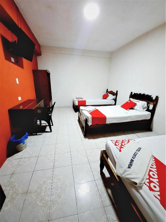Postel nebo postele na pokoji v ubytování Hotel Costa Maria