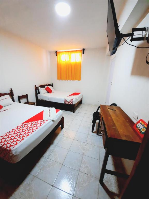 Postel nebo postele na pokoji v ubytování Hotel Costa Maria