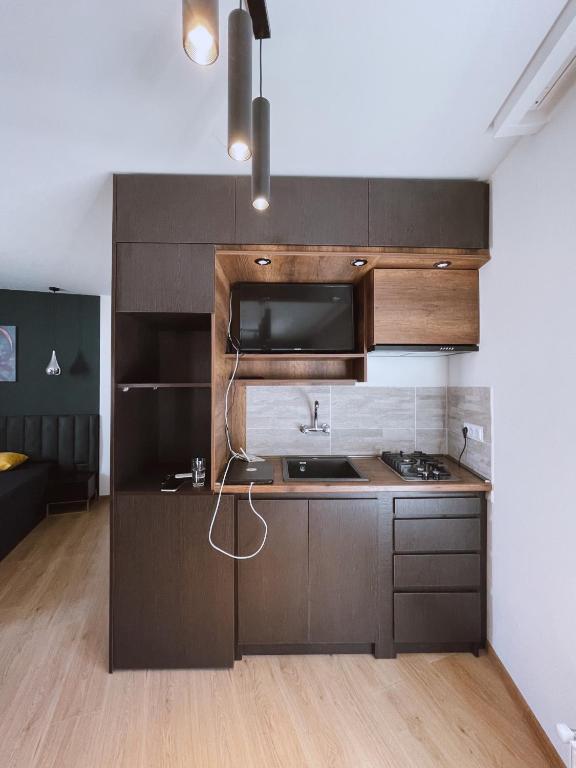 Kuchyň nebo kuchyňský kout v ubytování Hotel ULYSSES