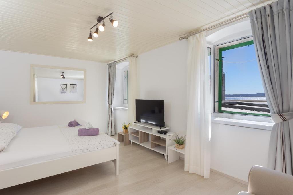 Postel nebo postele na pokoji v ubytování Apartment Petric, old town Hvar