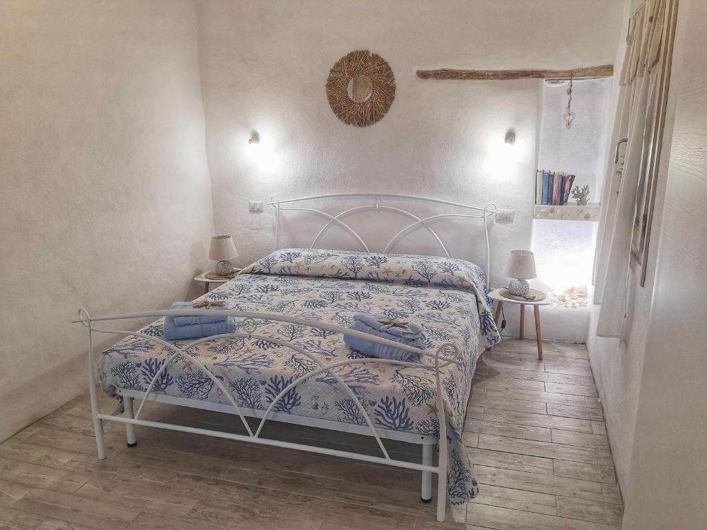Ліжко або ліжка в номері La conchiglia