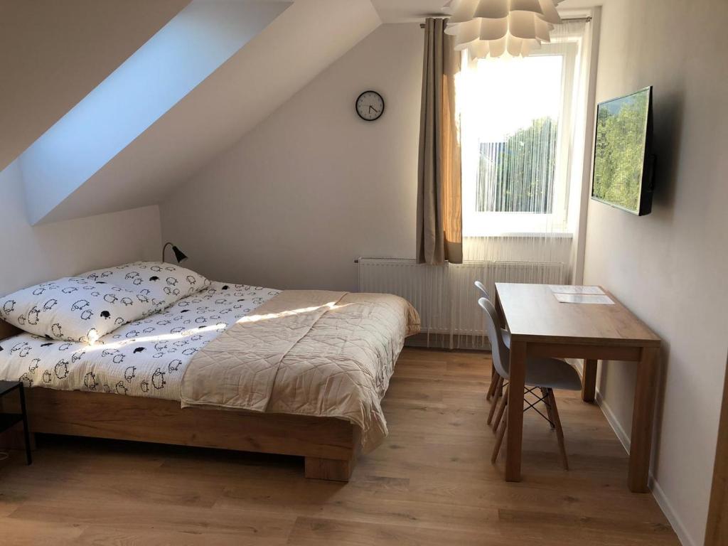 Posteľ alebo postele v izbe v ubytovaní Apartamenty Asturia Rymanów Zdrój