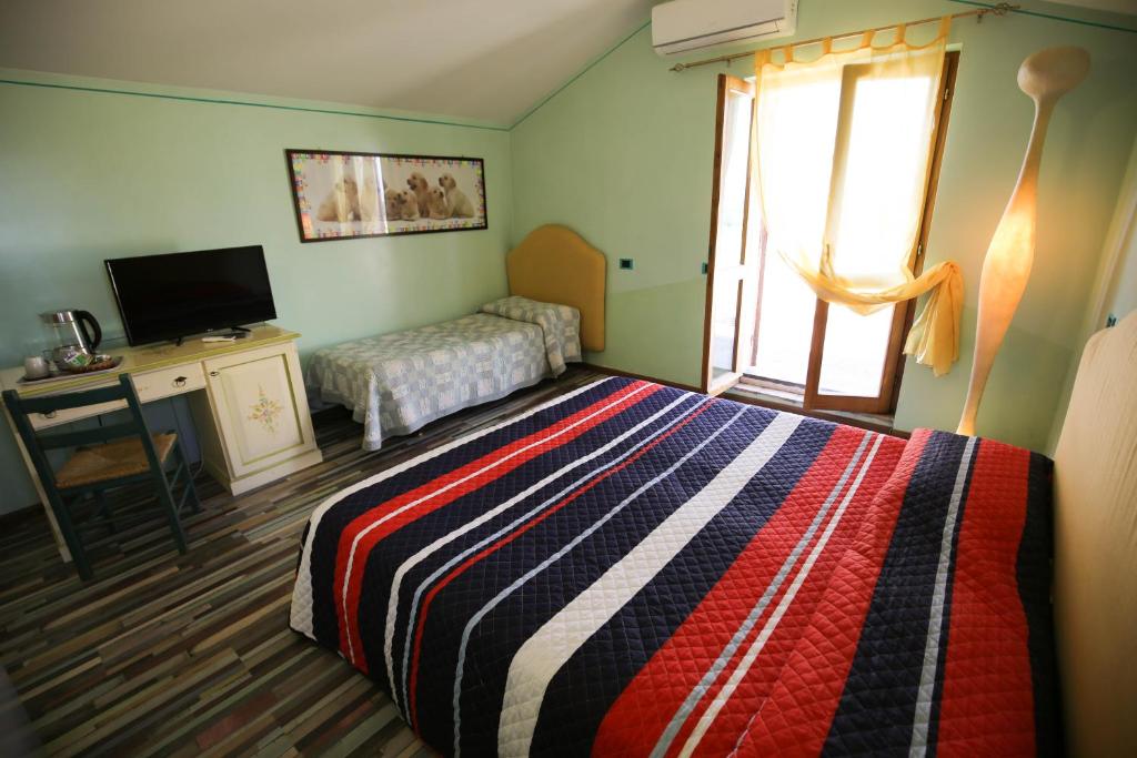 Postel nebo postele na pokoji v ubytování Hotel Benedetti