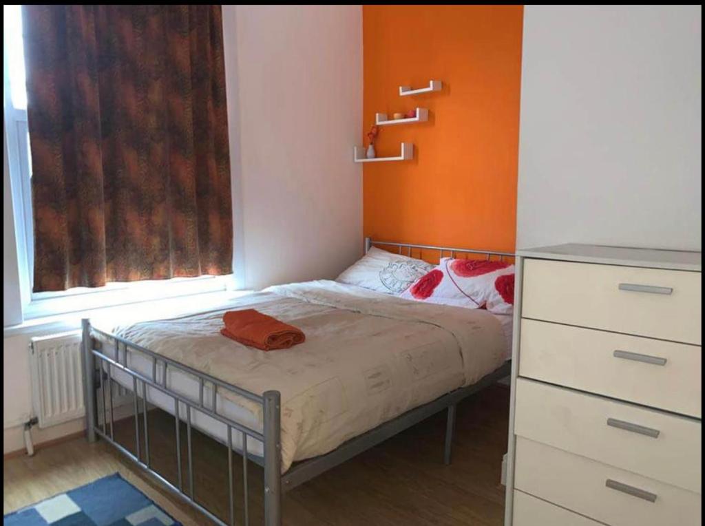 a small bedroom with a bed and a window at 03 Bedroom Apartment-Self Check in in London