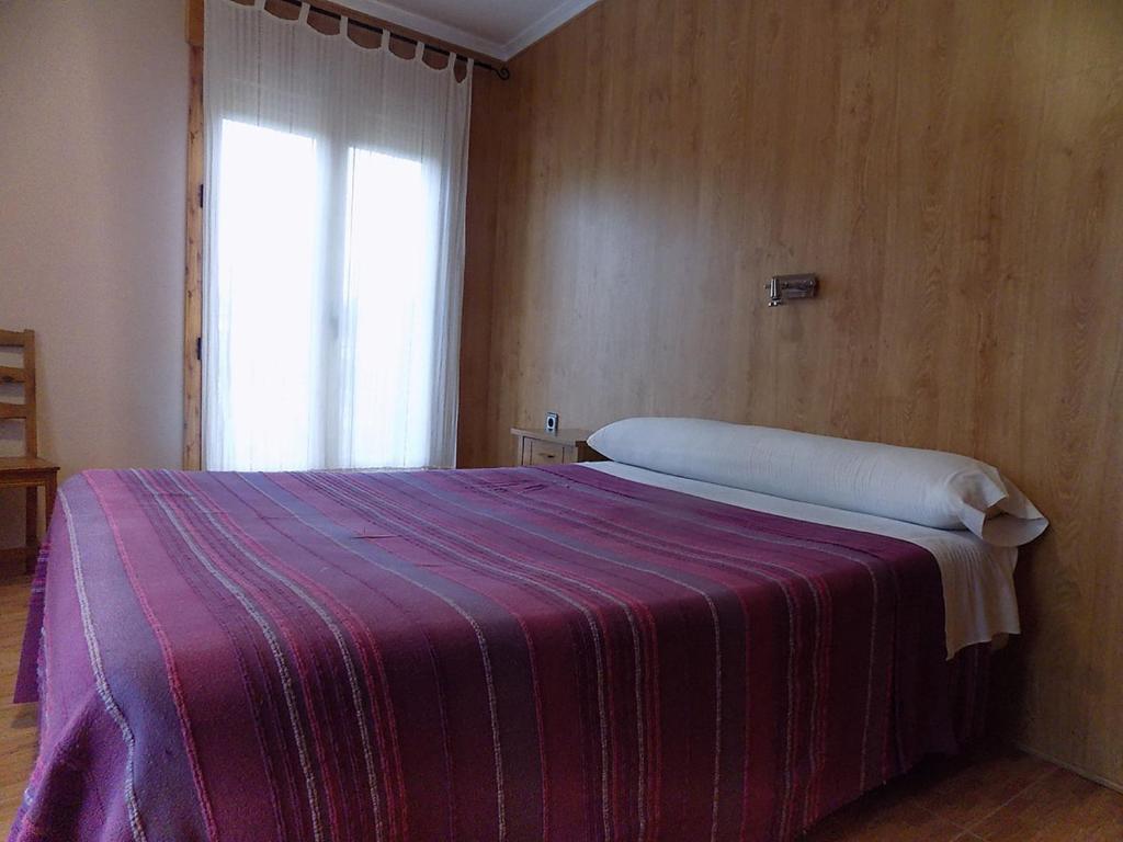 Postel nebo postele na pokoji v ubytování Hostal Los Palancares