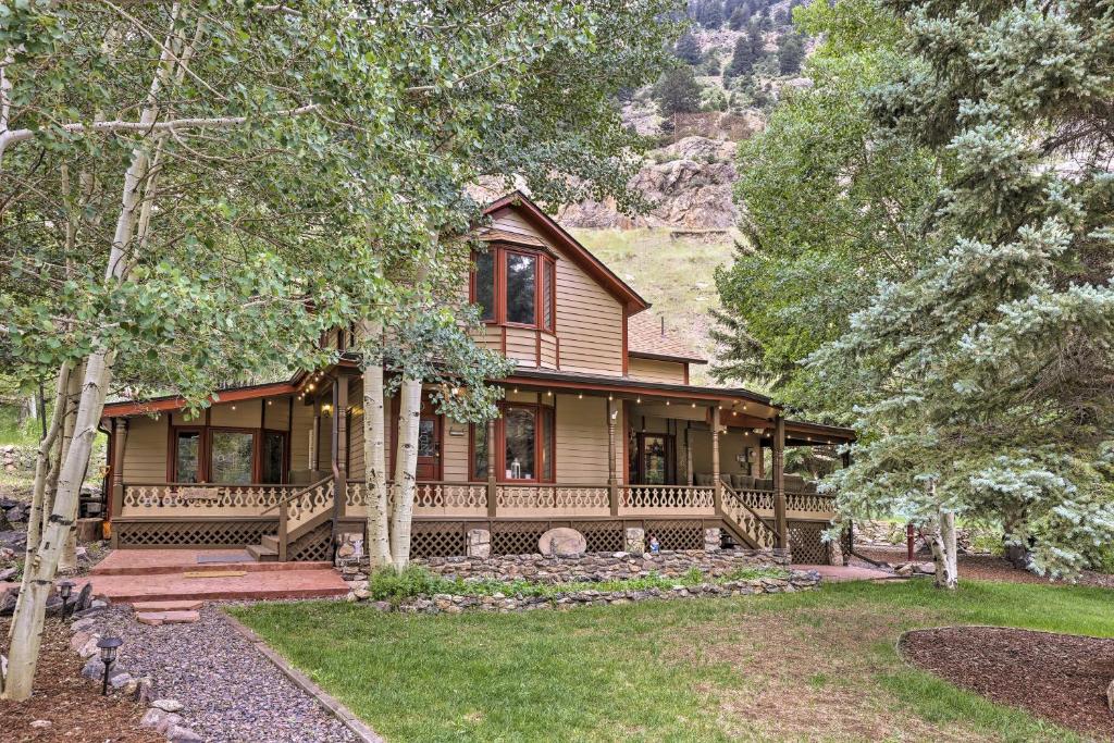 a large wooden house in the woods with trees at Family Home in Georgetown Walk to Town and Railroad in Georgetown