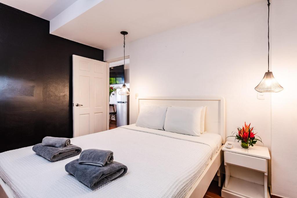 Postel nebo postele na pokoji v ubytování Hotel Gardenia Tamarindo