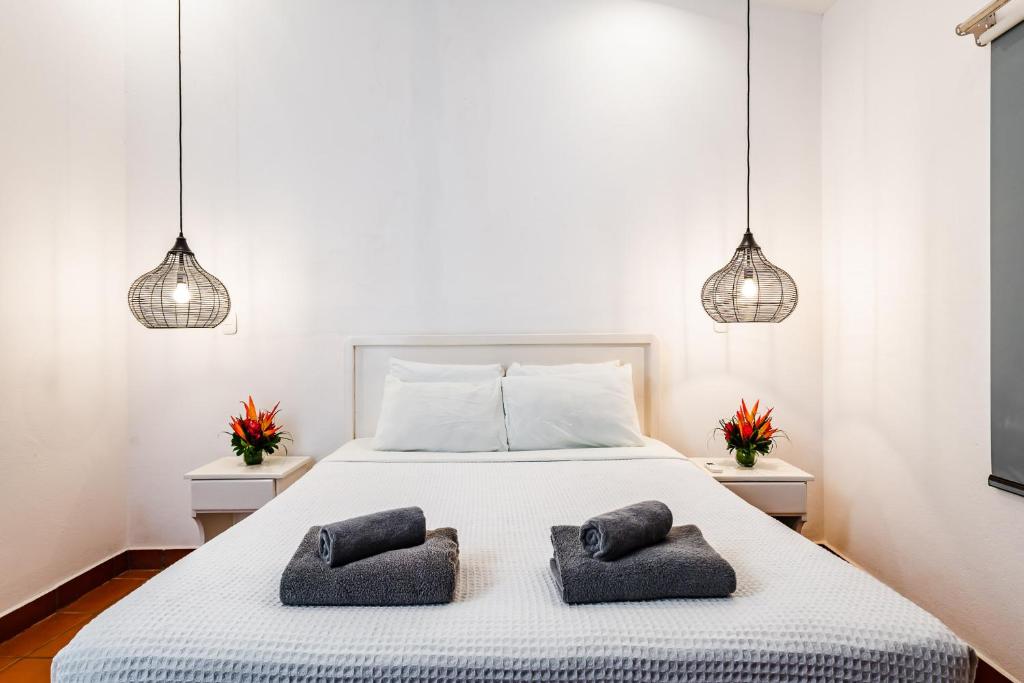 Postel nebo postele na pokoji v ubytování Hotel Gardenia Tamarindo