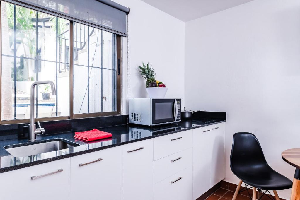 Kuchyň nebo kuchyňský kout v ubytování Hotel Gardenia Tamarindo