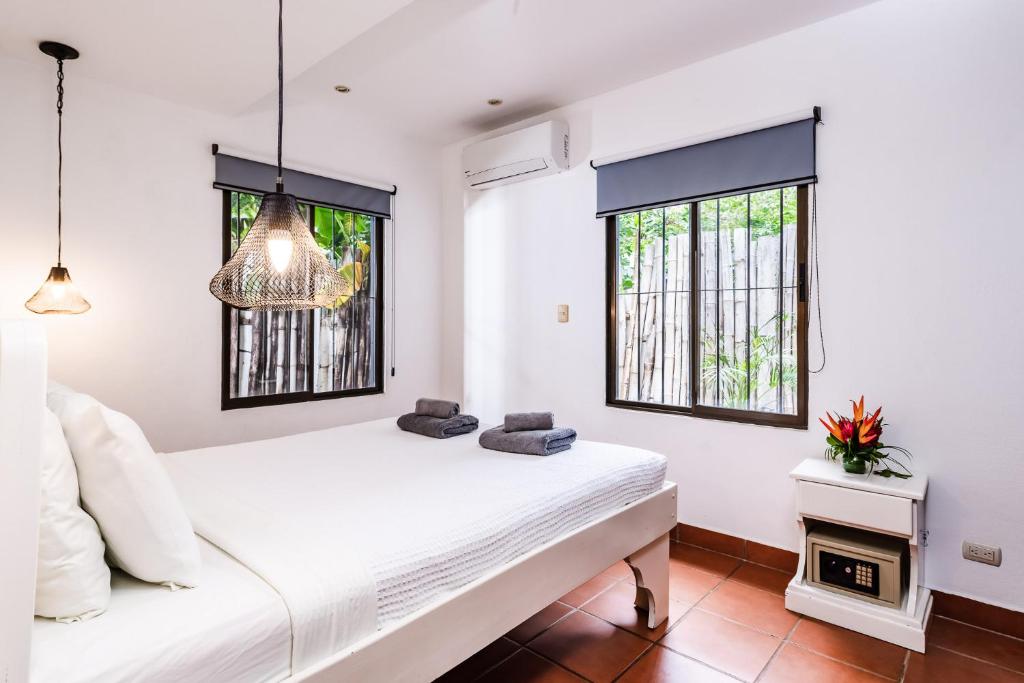 Postel nebo postele na pokoji v ubytování Hotel Gardenia Tamarindo