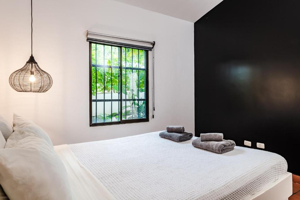 Postel nebo postele na pokoji v ubytování Hotel Gardenia Tamarindo