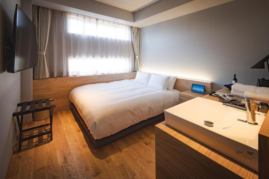 TV a/nebo společenská místnost v ubytování UNO HOTEL