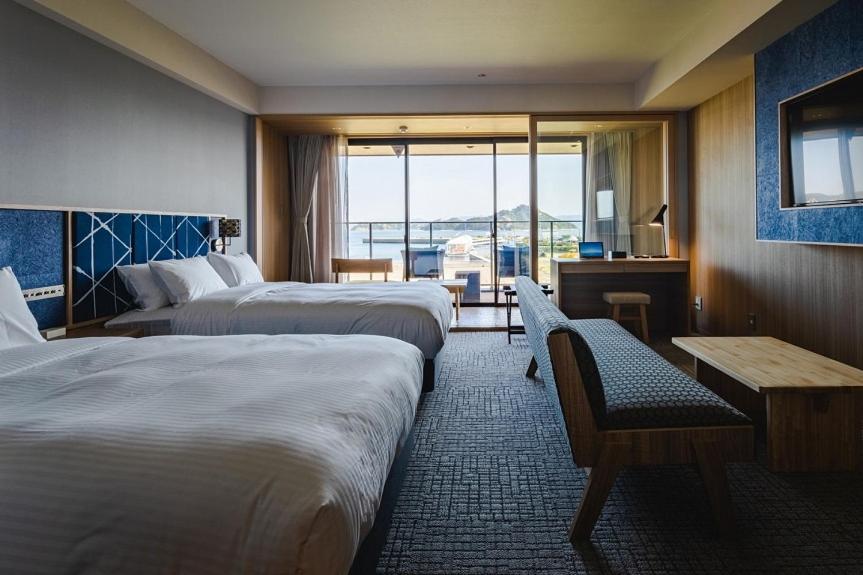 Postel nebo postele na pokoji v ubytování UNO HOTEL