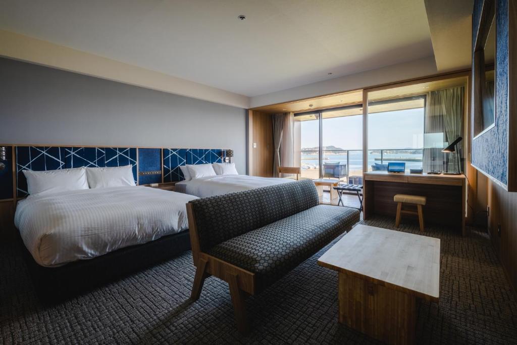 Postel nebo postele na pokoji v ubytování UNO HOTEL