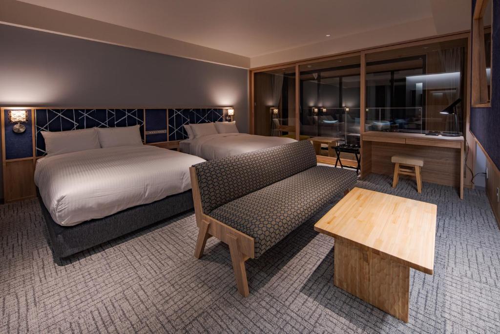 Postel nebo postele na pokoji v ubytování UNO HOTEL
