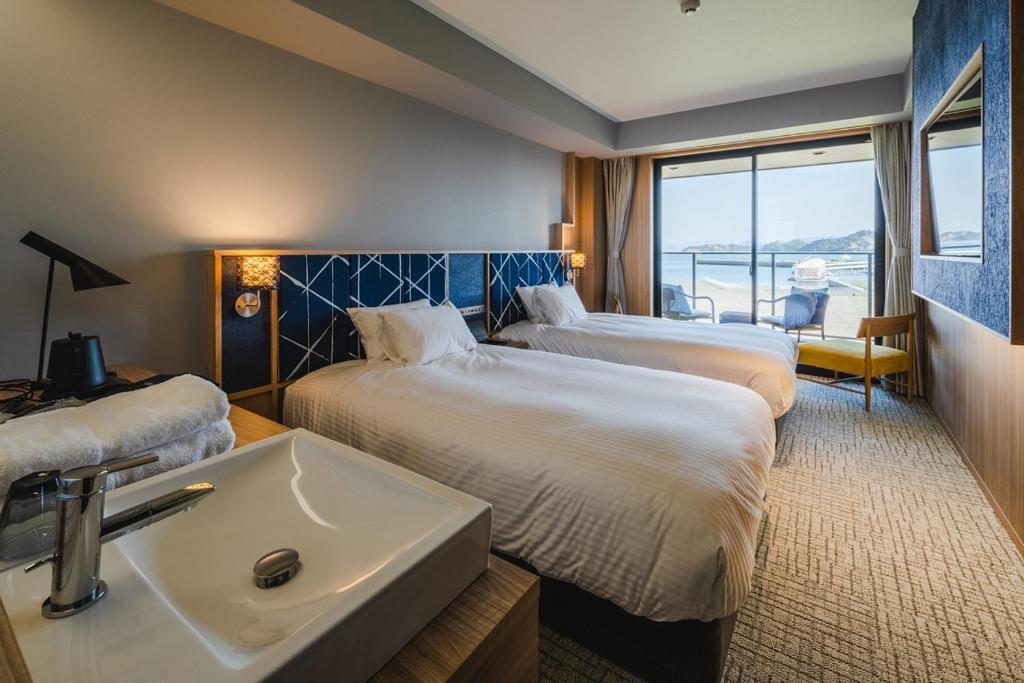 Postel nebo postele na pokoji v ubytování UNO HOTEL
