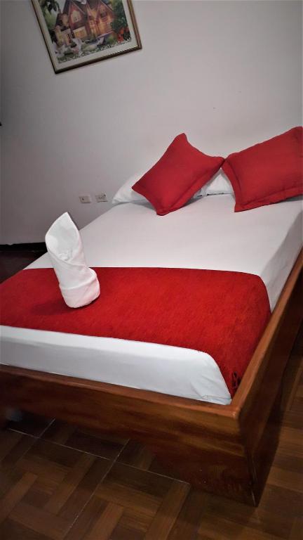 Postel nebo postele na pokoji v ubytování Hostal El Pinzón