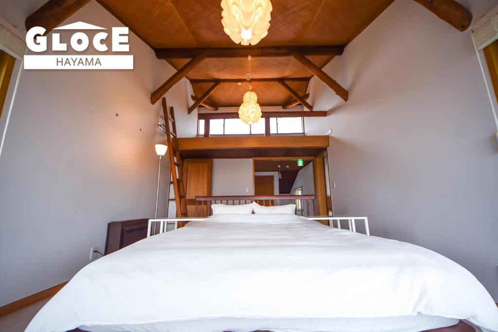 Postel nebo postele na pokoji v ubytování GLOCE 葉山 Ocean View House 都心から1時間 湘南の絶景を独り占めペットok 出張BBQ有り
