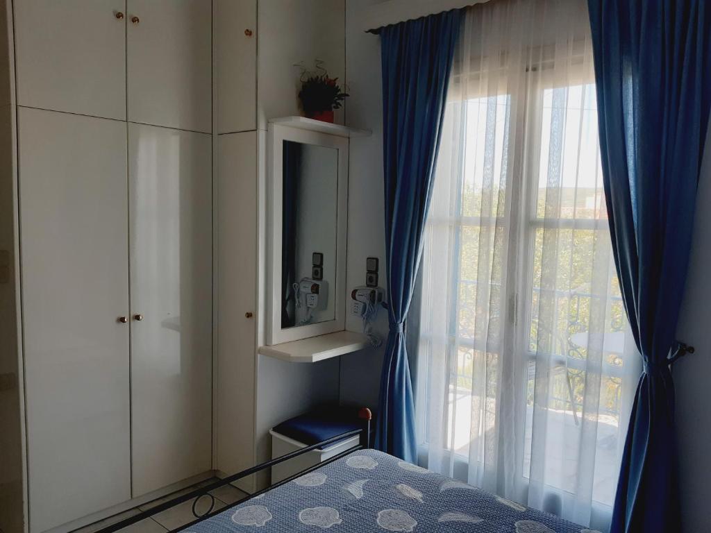 Postel nebo postele na pokoji v ubytování Aloi Studios