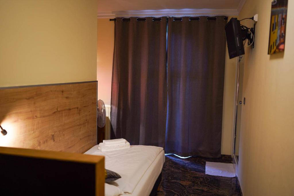 Postel nebo postele na pokoji v ubytování Hotel Prins van Oranje