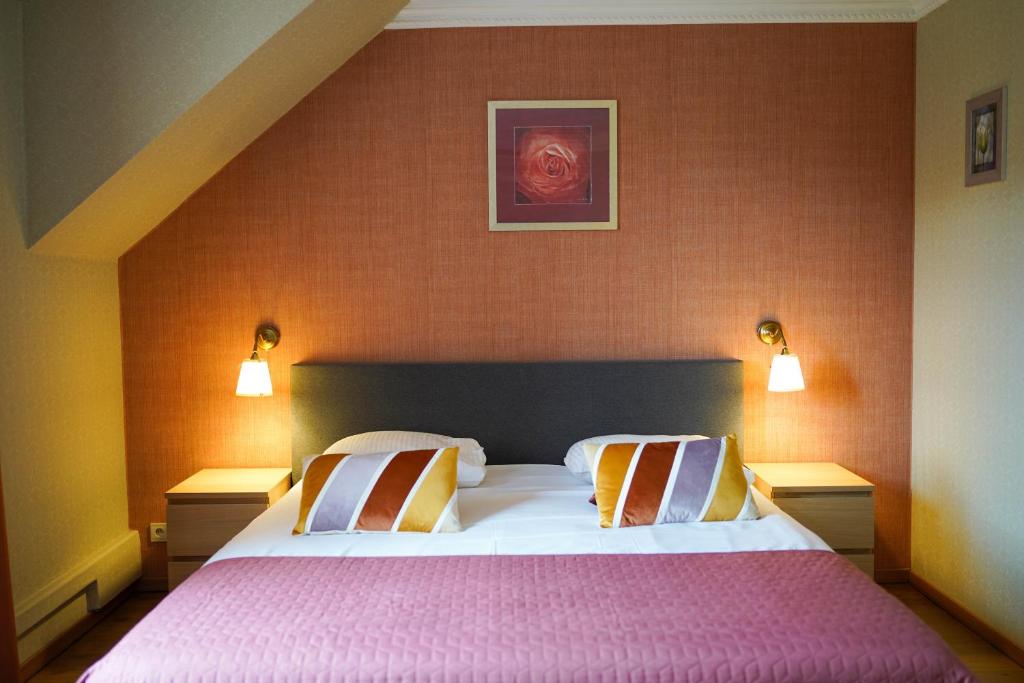 Postel nebo postele na pokoji v ubytování Hotel Prins van Oranje