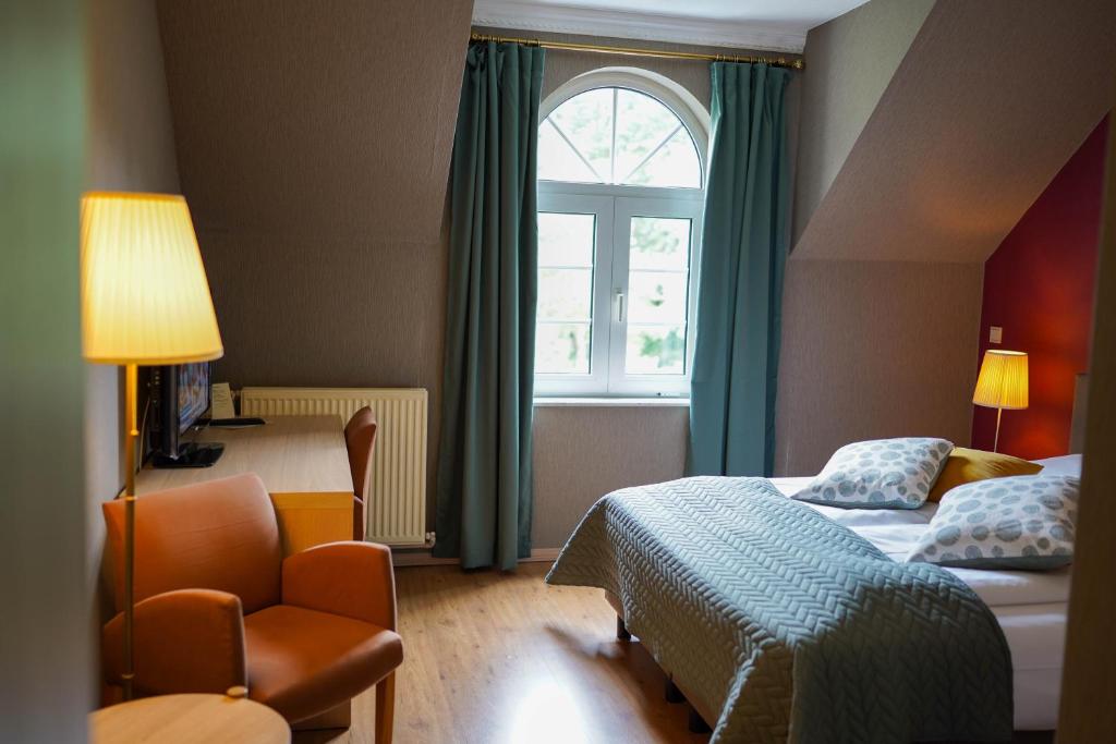 Postel nebo postele na pokoji v ubytování Hotel Prins van Oranje