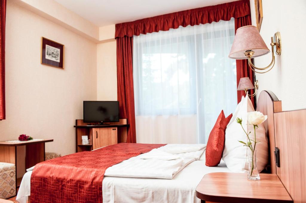 Postel nebo postele na pokoji v ubytování Beatrix Hotel