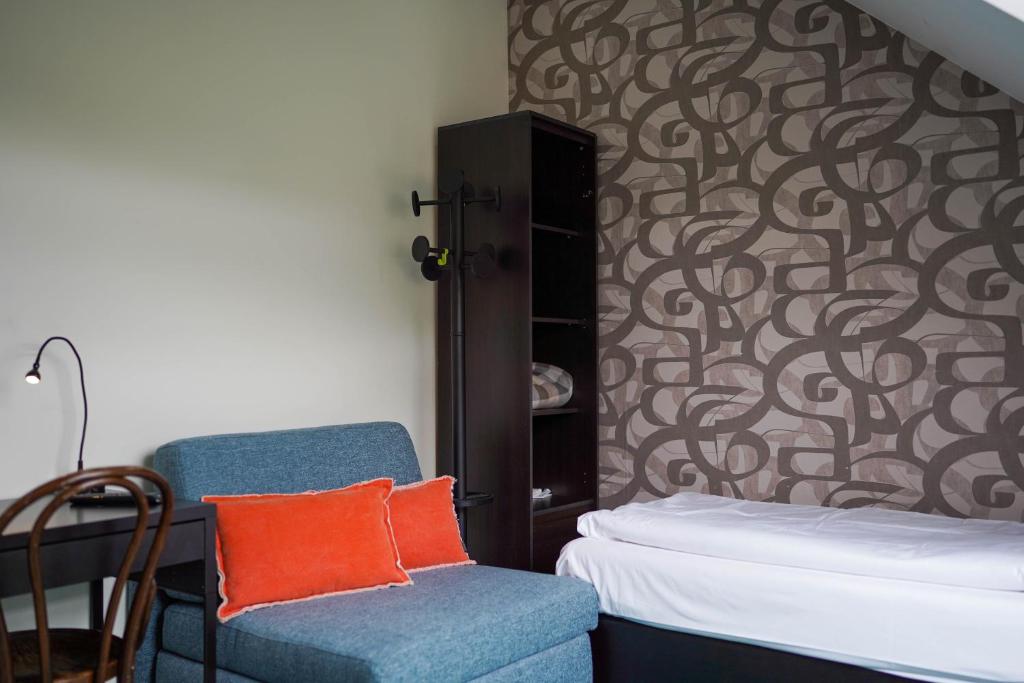 Postel nebo postele na pokoji v ubytování Hotel Prins van Oranje
