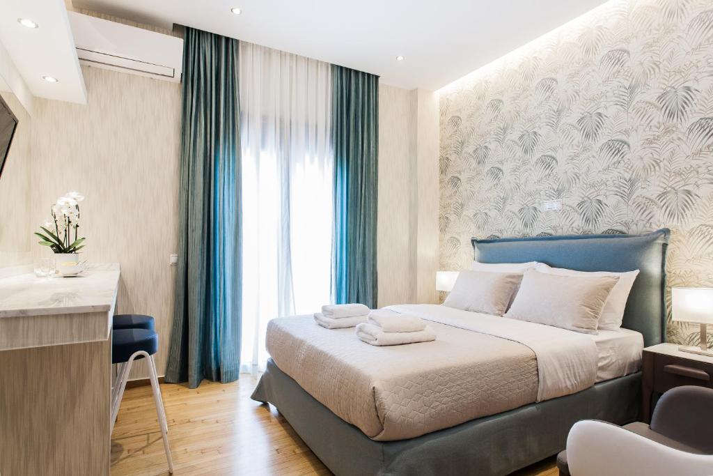 Posteľ alebo postele v izbe v ubytovaní Nicholas Point Apartments and Rooms