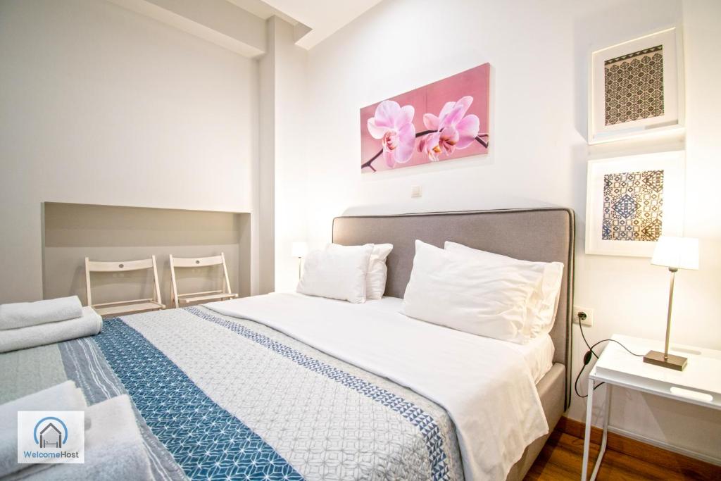 Łóżko lub łóżka w pokoju w obiekcie Syntagma Square Athenian apartments