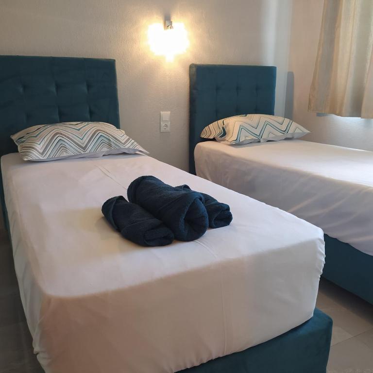 Łóżko lub łóżka w pokoju w obiekcie Mei's luxury apartments