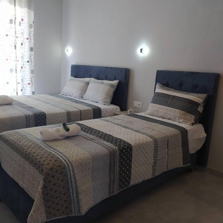 Łóżko lub łóżka w pokoju w obiekcie Mei's luxury apartments