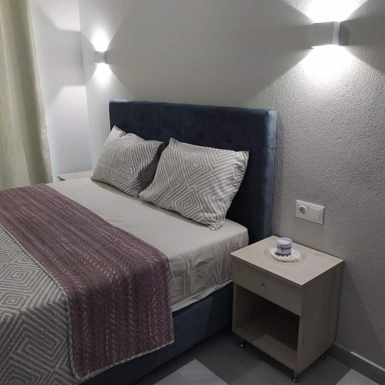 Łóżko lub łóżka w pokoju w obiekcie Mei's luxury apartments