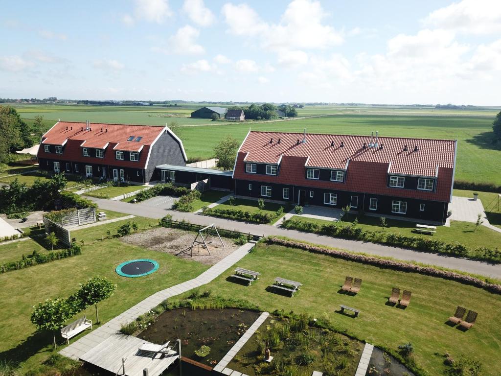 an aerial view of a large building with a yard at Nieuw Leven Texel in Den Burg
