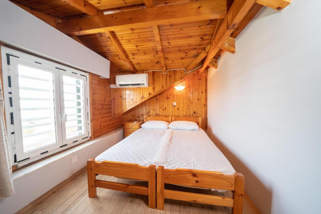 A bed or beds in a room at Xi Village