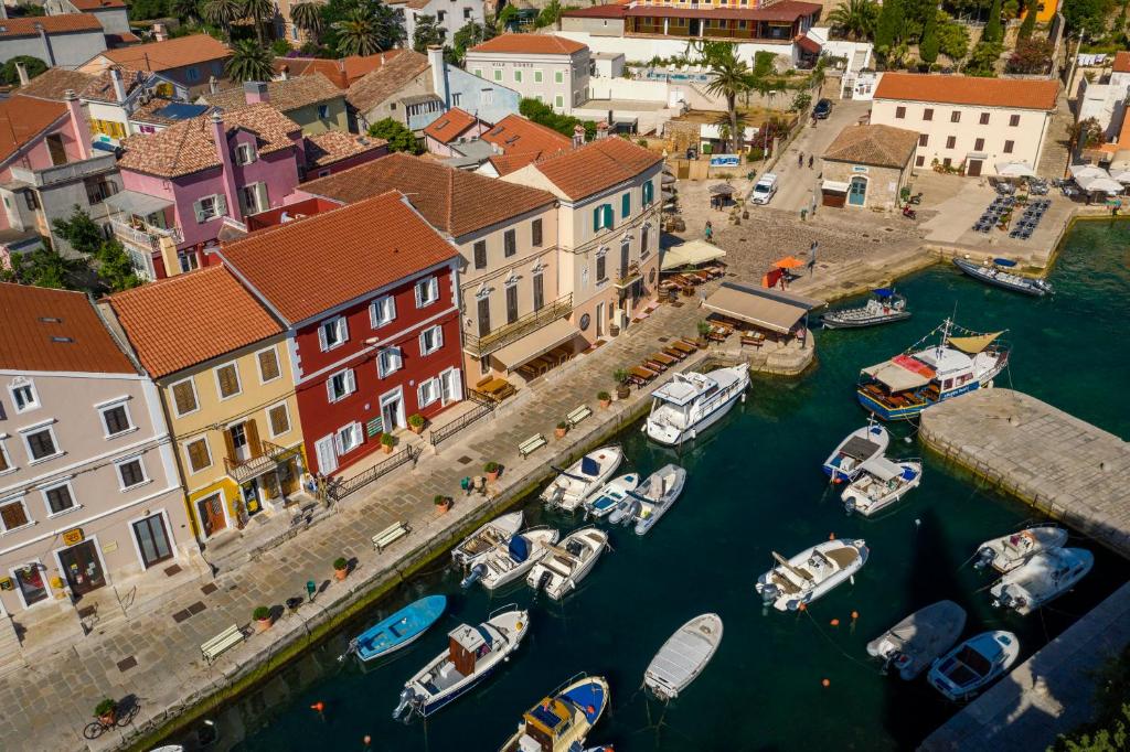 an aerial view of a harbor with boats in the water at Bed and breakfast Ciao Bella in Veli Lošinj