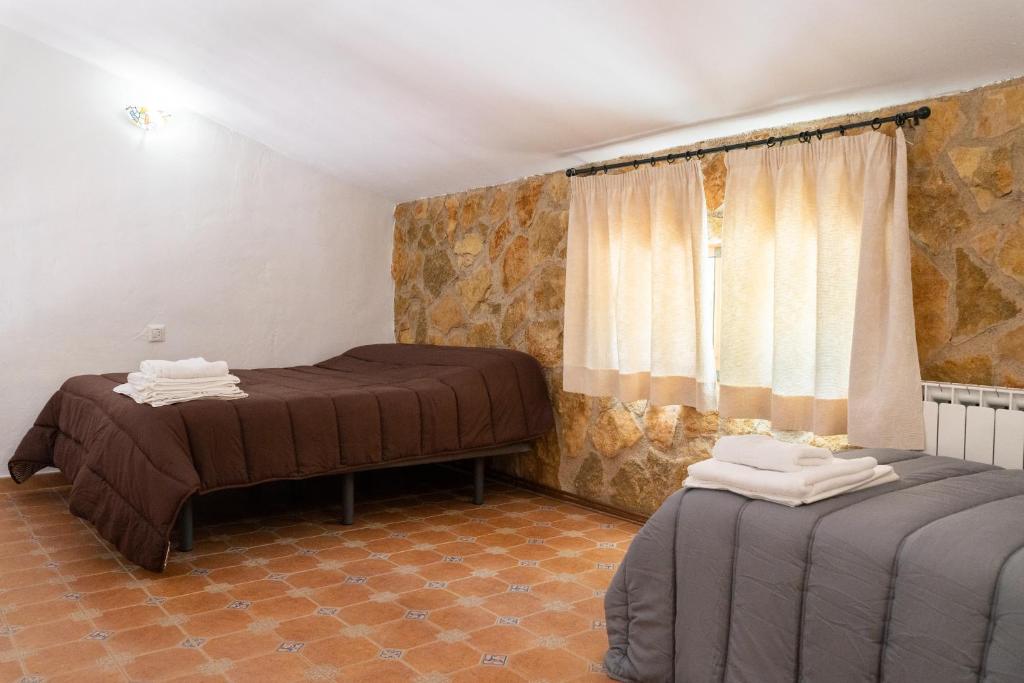 Postel nebo postele na pokoji v ubytování Hospedium DLJ Respira Cazorla
